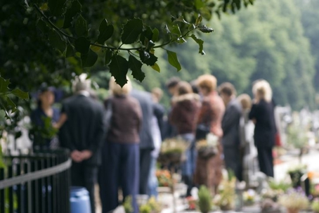 Family gathering at a graveside