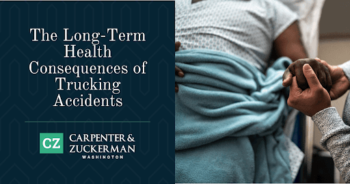 Man in hospital bed having his hand held my his family member