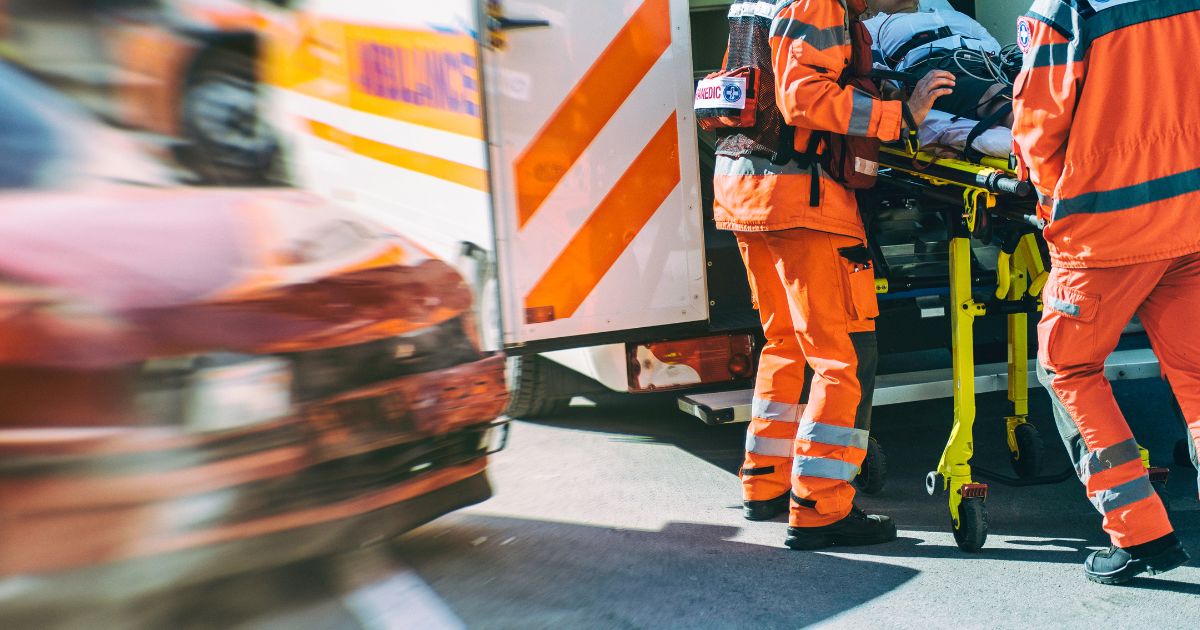 wrecked car next to ambulance